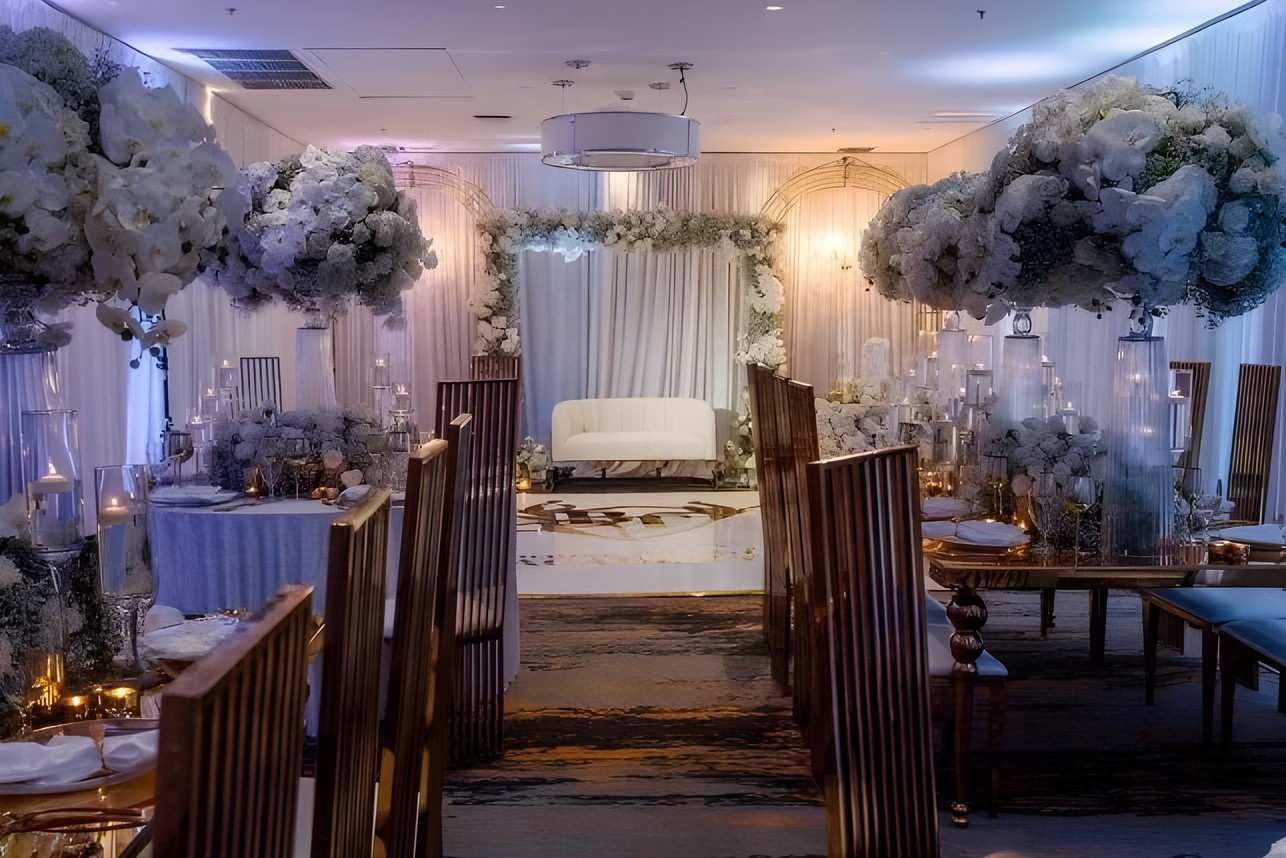 Reception aisle with white florals and gold chairs